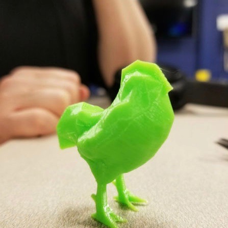 photo of a bright green 3D printed rooster