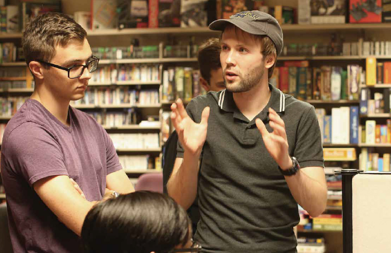 A photo of a man speaking to students